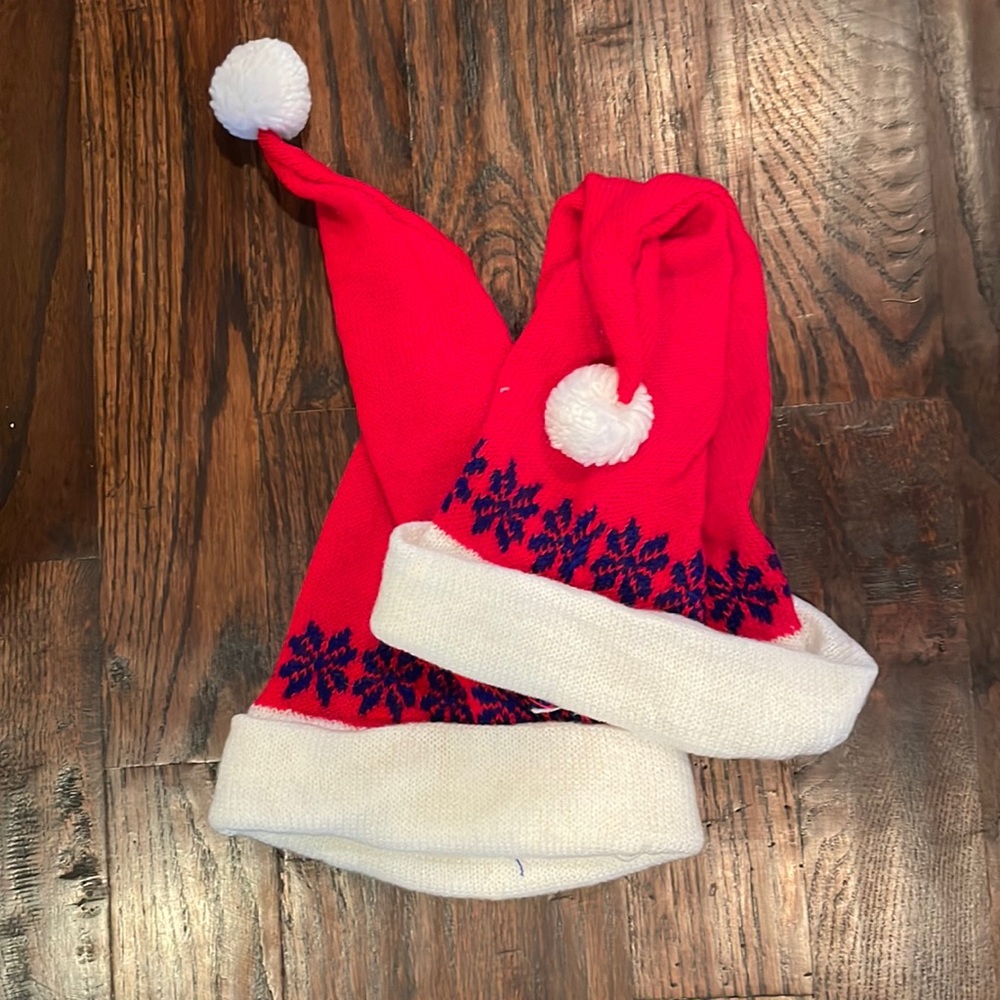Set of 2 Red Knit Santa Hats with Blue Snowflakes.